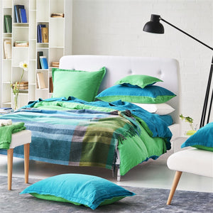 Designers Guild Bampton Emerald Woven Throw on Bed