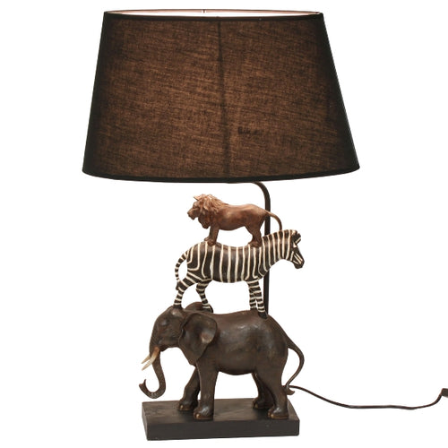 Table lamp with elephant, zebra, and lion standing on top of each other